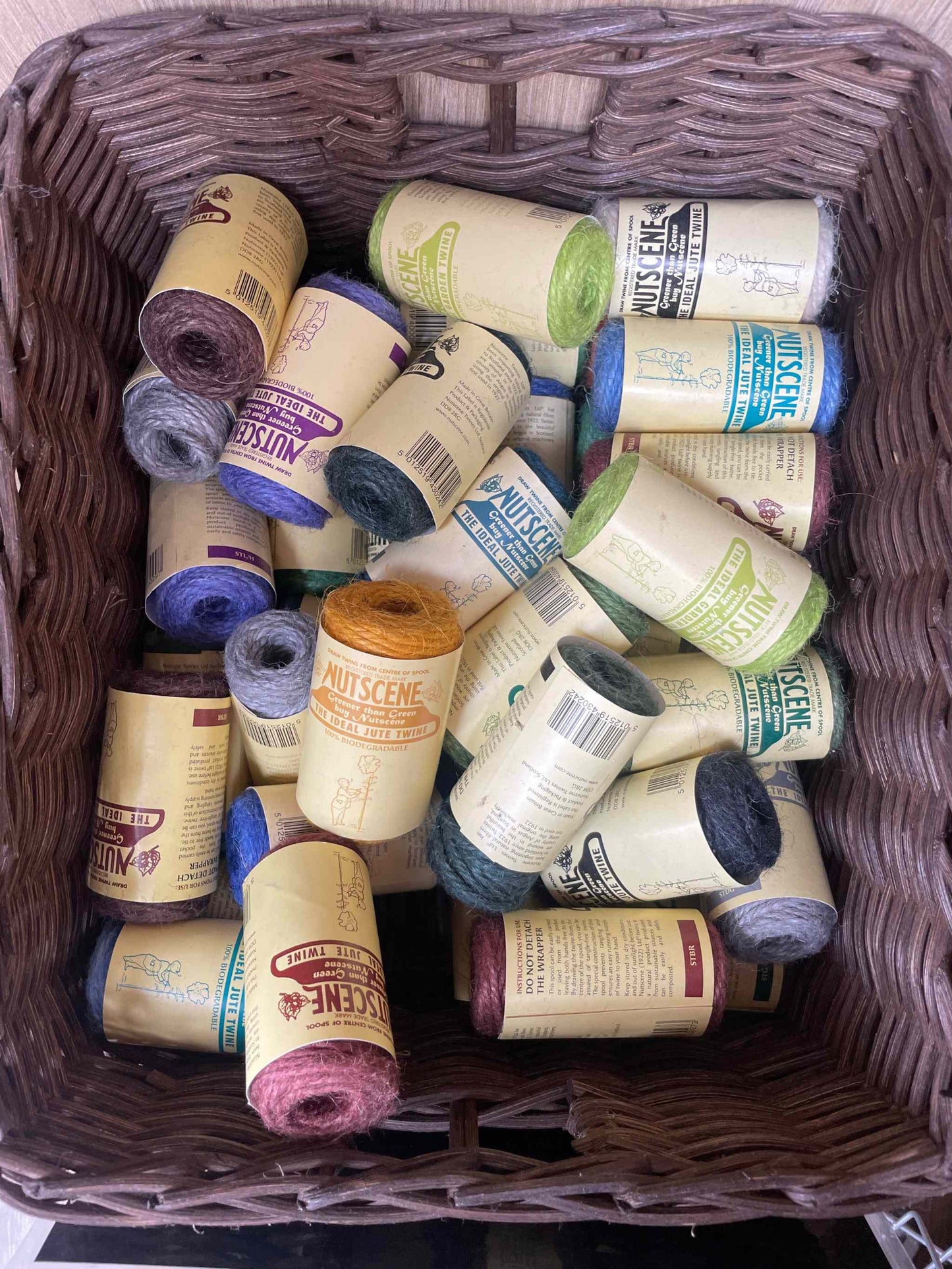 Jute twine rolls in various colors, biodegradable eco-friendly crafting essential.