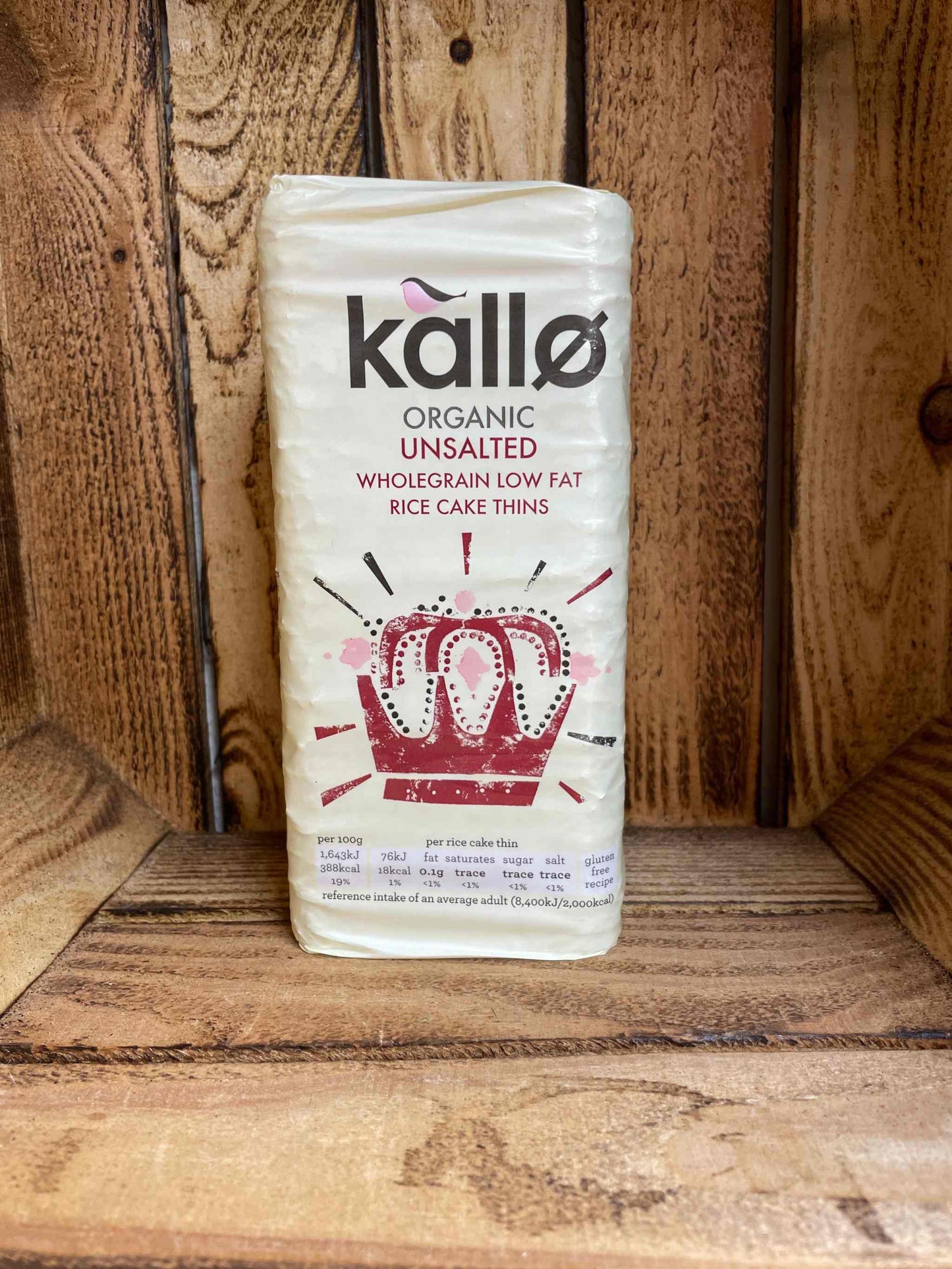 Organic unsalted rice cakes on wooden shelf packaging.