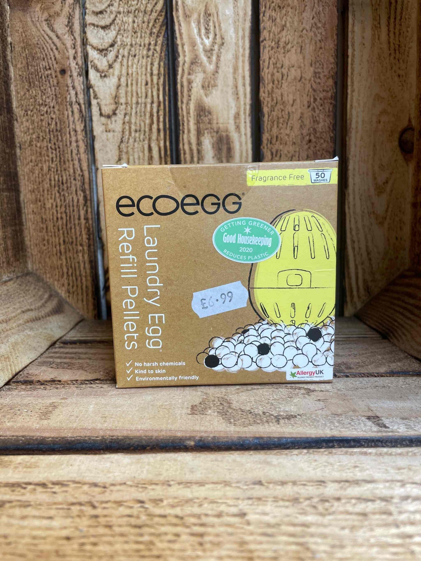 Eco-friendly Laundry Eco Egg refill box with fresh linen scent on wooden background.