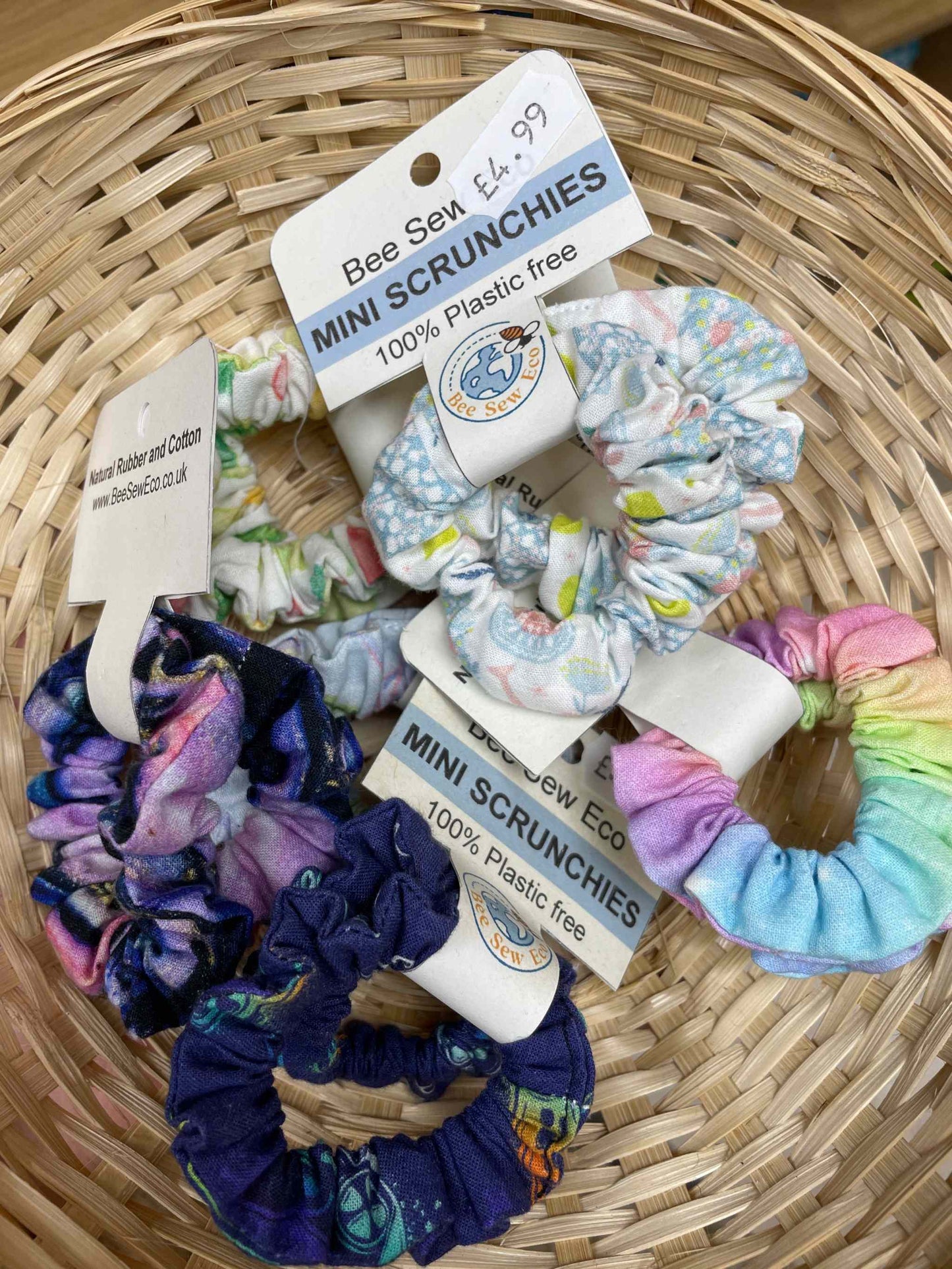 Eco Coach House 2 Pack Scrunchies, eco-friendly hair accessories in a basket, sustainable fashion.