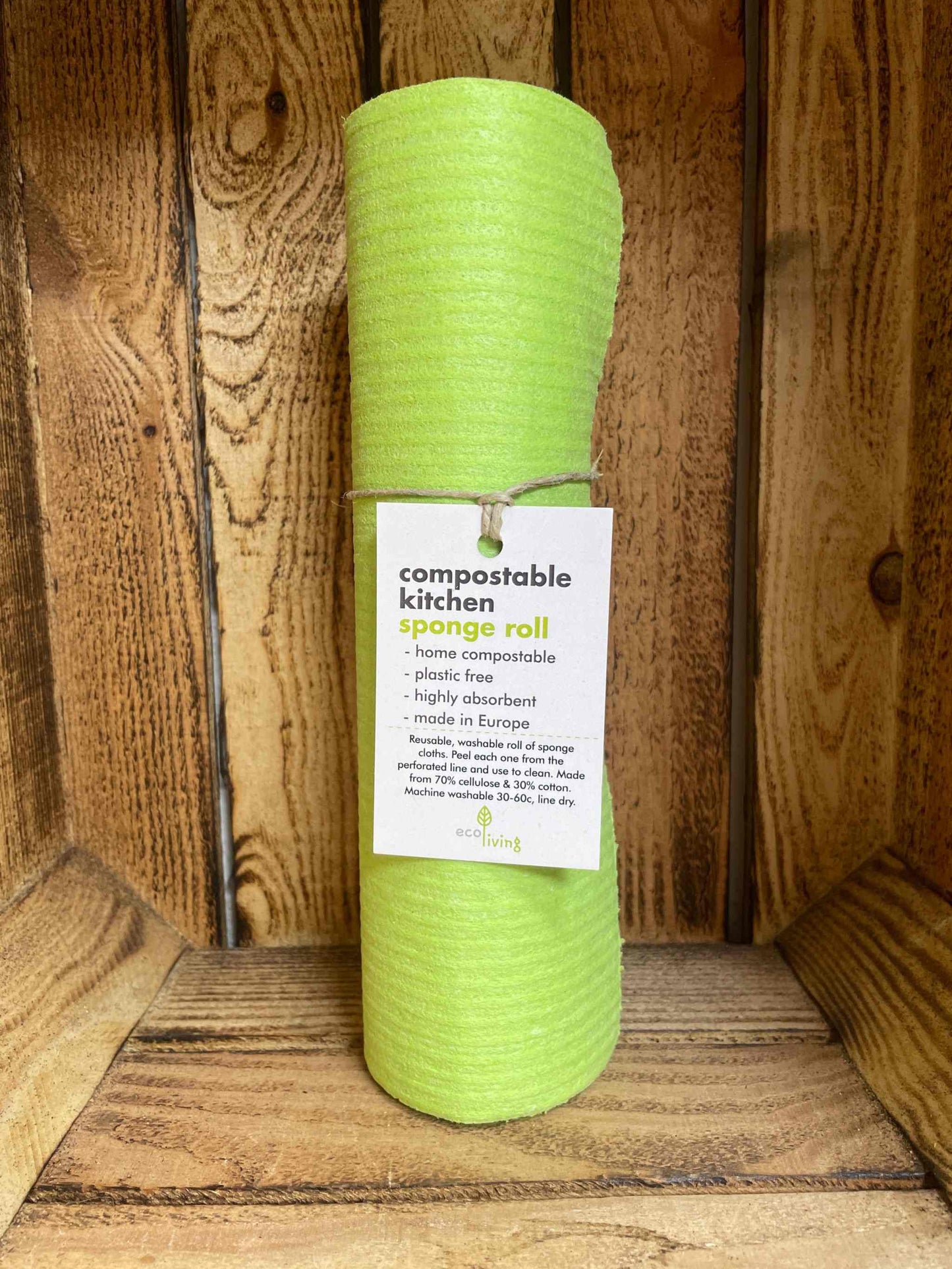 Compostable kitchen roll, eco-friendly and washable, made from biodegradable materials, displayed on a wooden shelf.