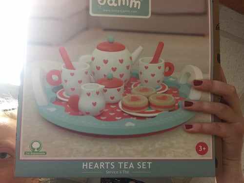 Hearts Tea Set with heart patterns, including teapot, cups, sugar bowl, and creamer, ideal for gifting and enhancing tea experiences.