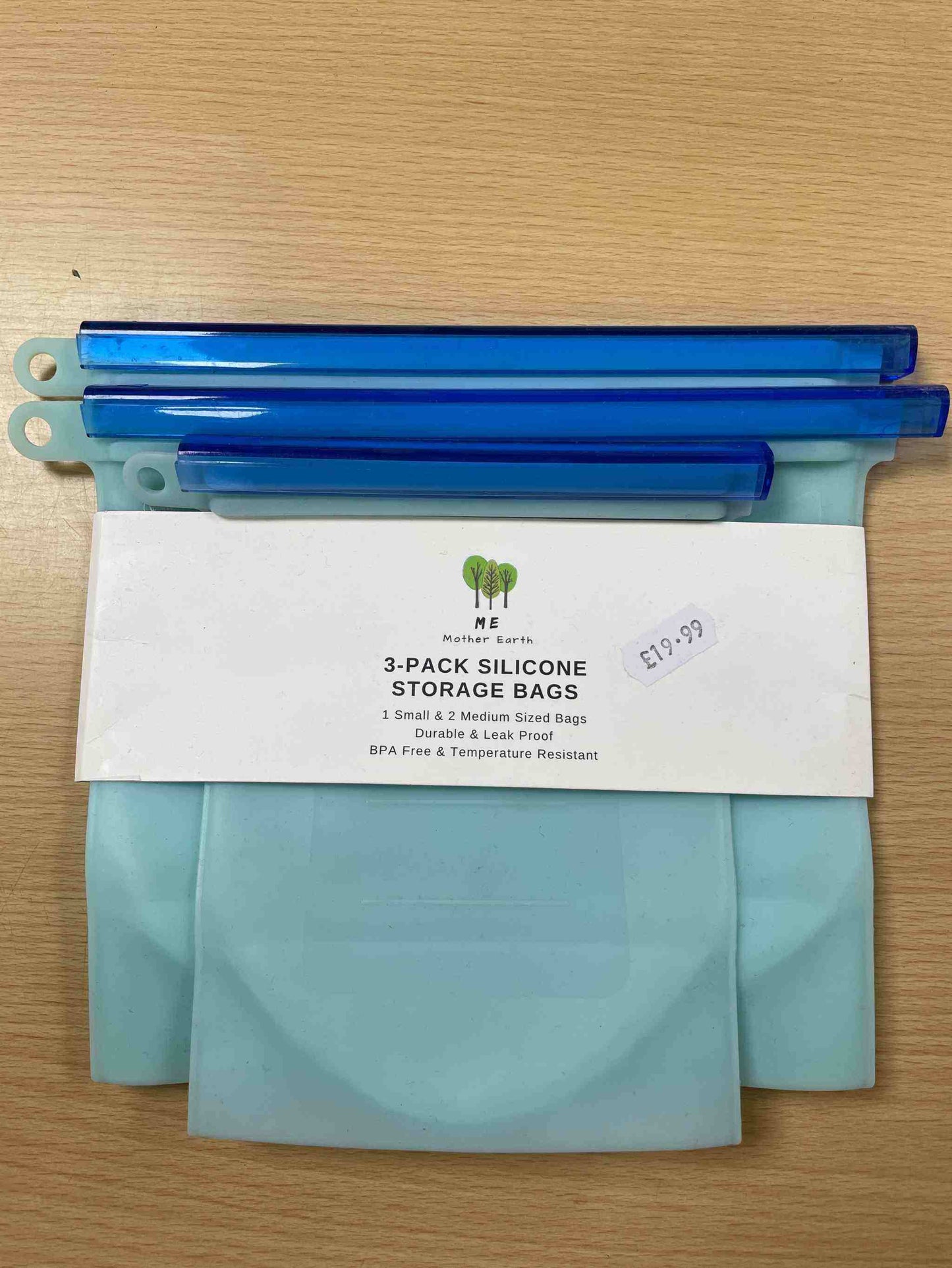 Three pack silicone storage bags, eco-friendly, reusable, BPA-free, airtight seal, versatile kitchen storage.