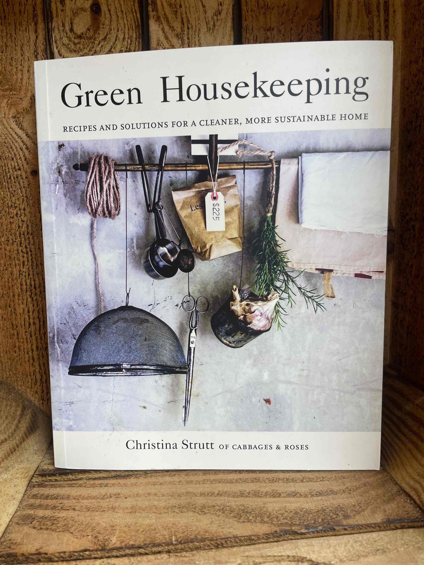 Green Housekeeping book cover showcasing eco-friendly cleaning solutions and sustainable home practices.