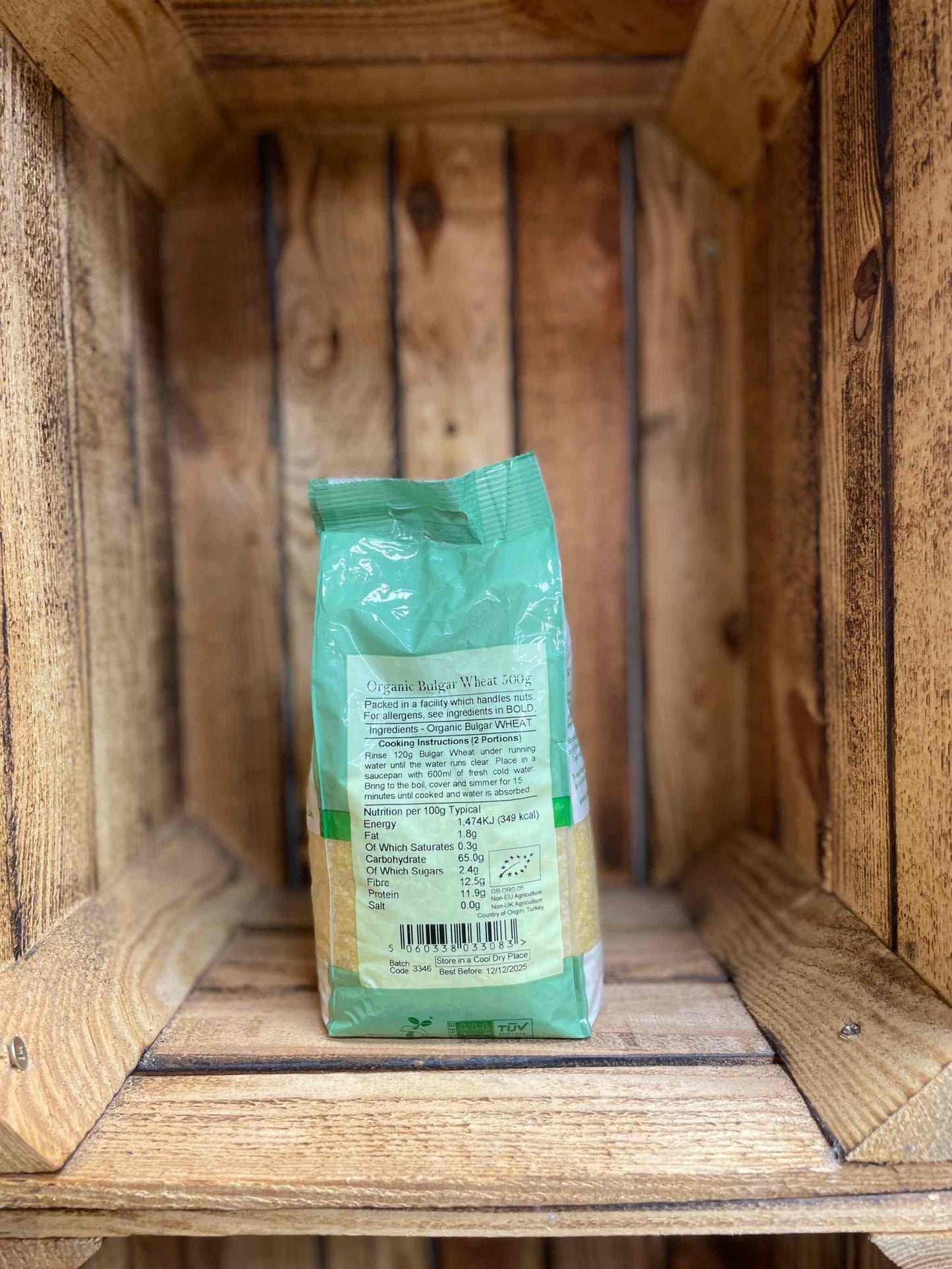 Organic Bulgar Wheat 500g in eco-friendly packaging, displayed on a wooden shelf.