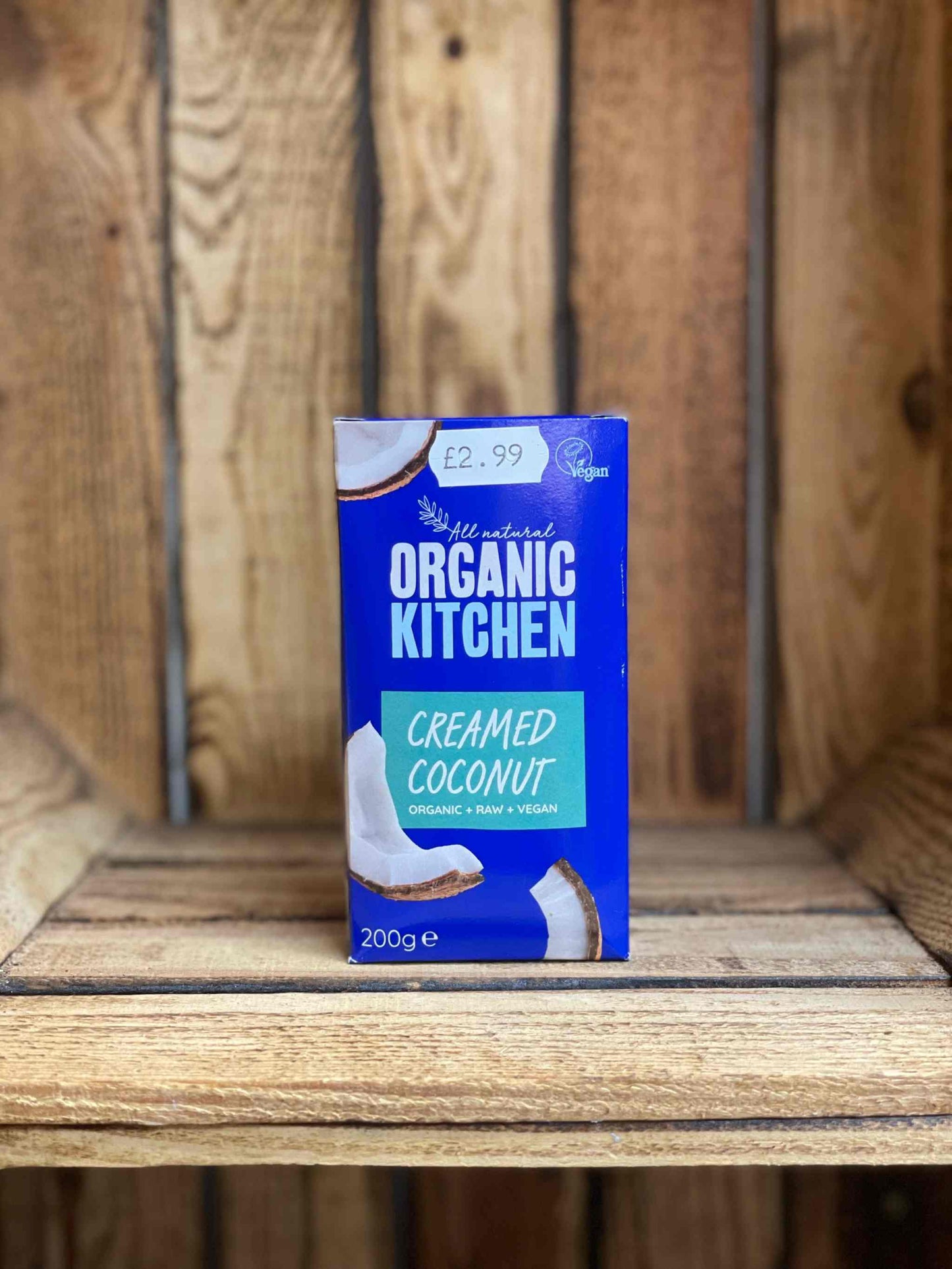Organic Kitchen Creamed Coconut, 200g, vegan option on wooden shelf.