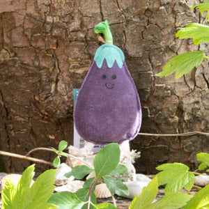 Eco-friendly aubergine-shaped dog toy, durable for aggressive chewers.