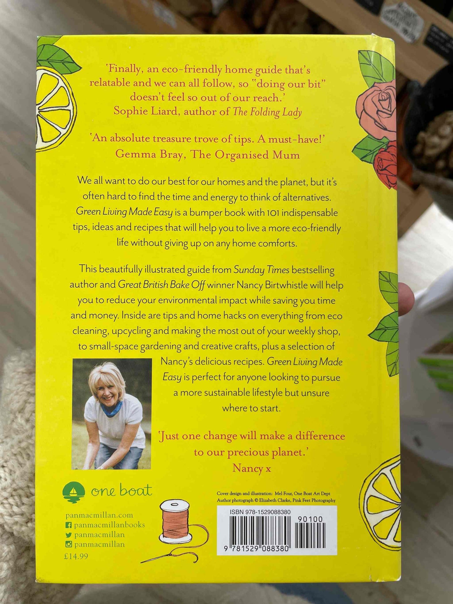 Back cover of the book "Green Living Made Easy" showcasing eco-friendly home guide with illustrations of citrus and flowers.