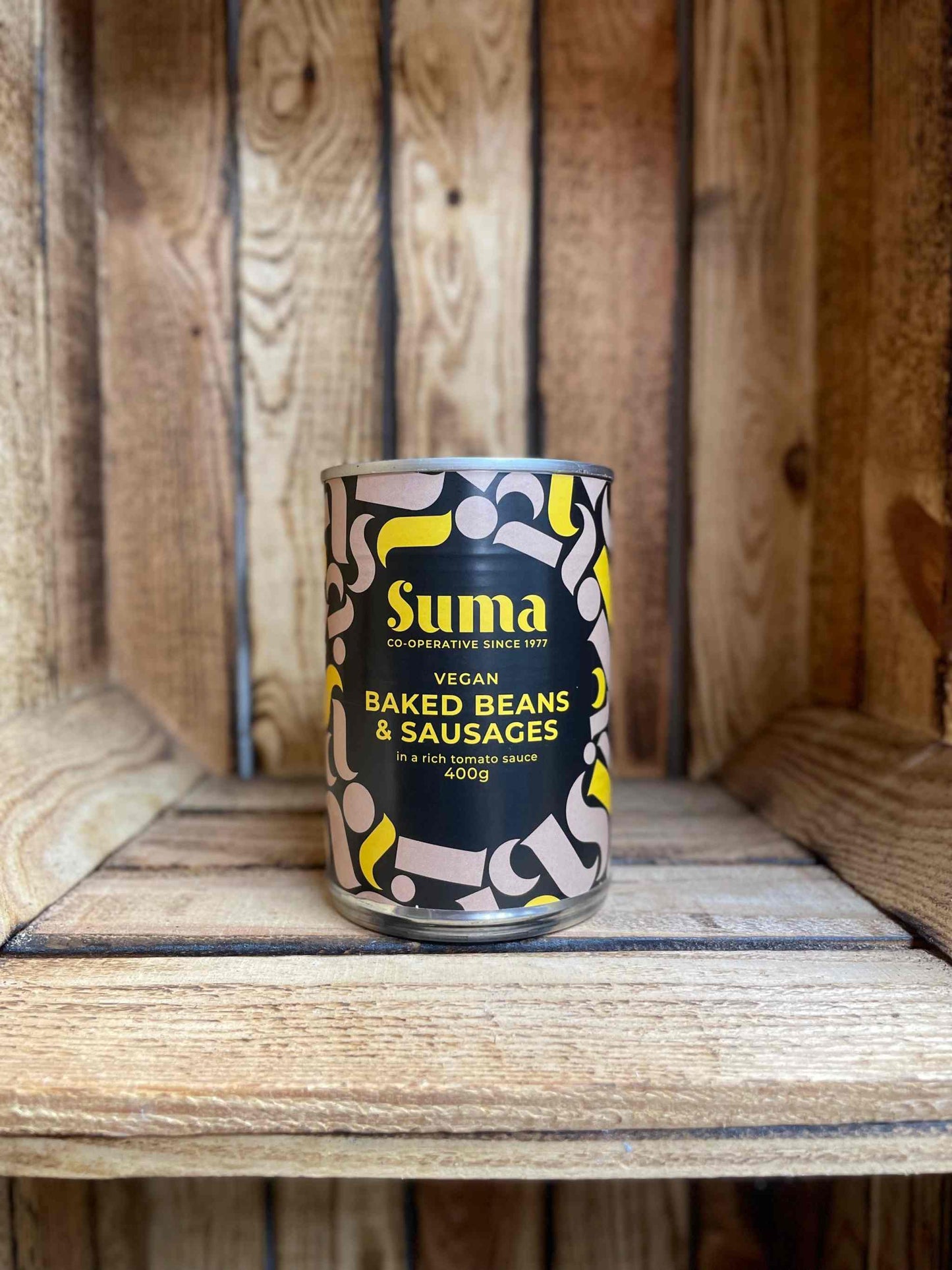 Suma Tins & Jars product on wooden shelf.