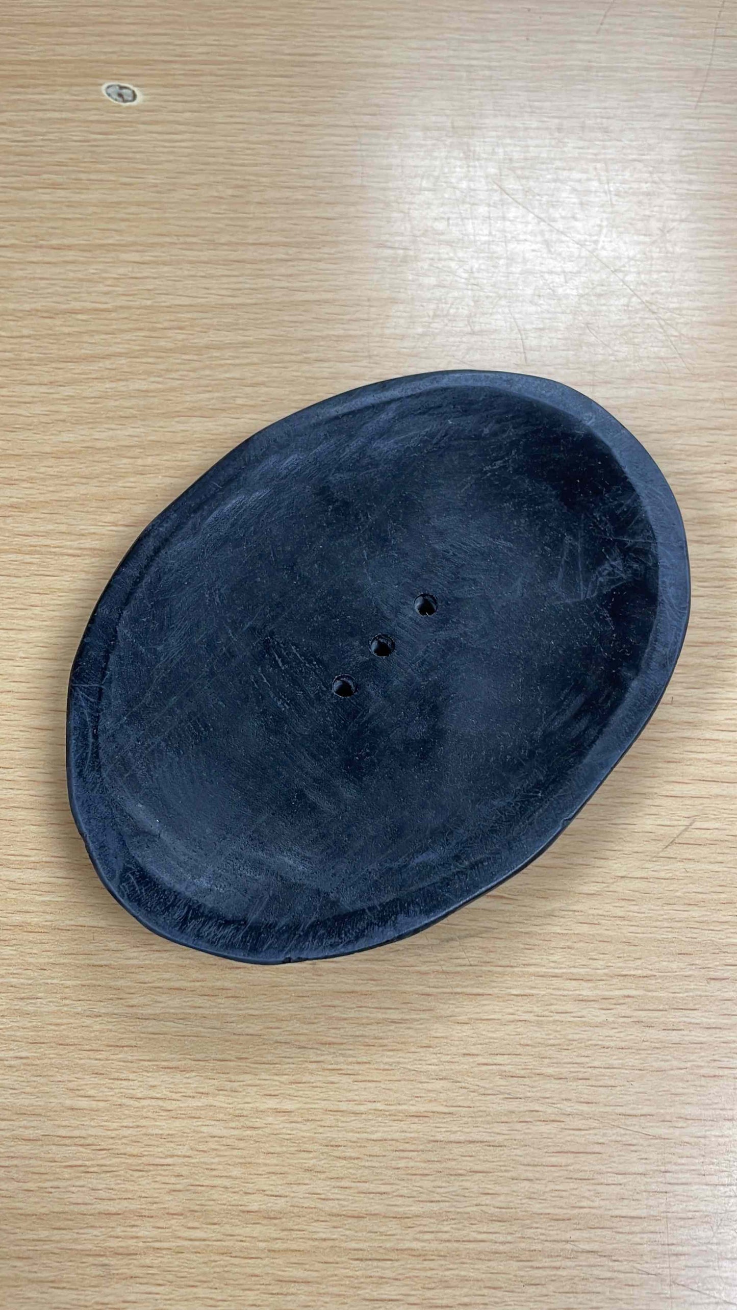 Soapstone hand-made soap dish with unique veining and color variations, crafted by skilled artisans.