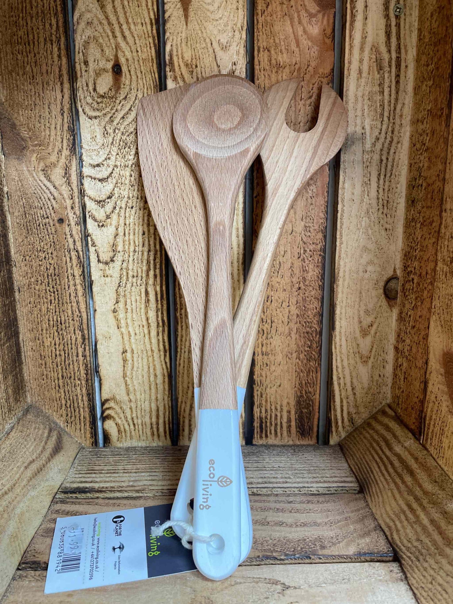 Set of three kitchen servers with FSC sustainable wood and white handles, displayed against a wooden background.