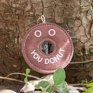 Eco-friendly dog toy, Derrick the Donut, sustainable play, durable design.