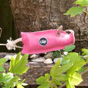 Eco-friendly dog toy, Peggy the Pig, made from recycled materials, designed for durability and playful engagement.