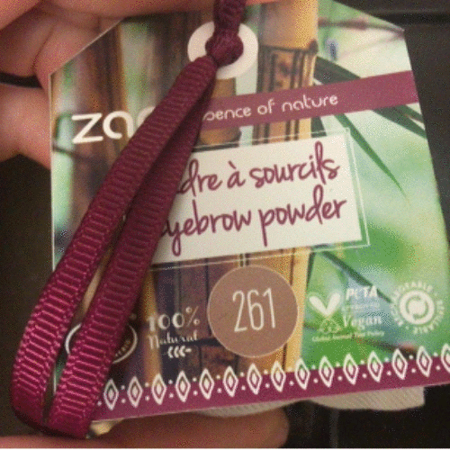 Eye brow powder label with vegan and natural certifications.