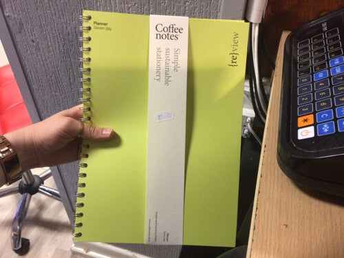 Green Planner-Seven-Day with spiral binding, designed for effective time management and productivity.