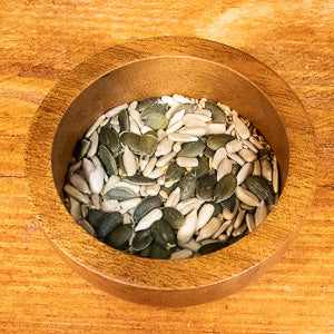 Organic 4-seed mix in wooden bowl, nutritious superfood blend