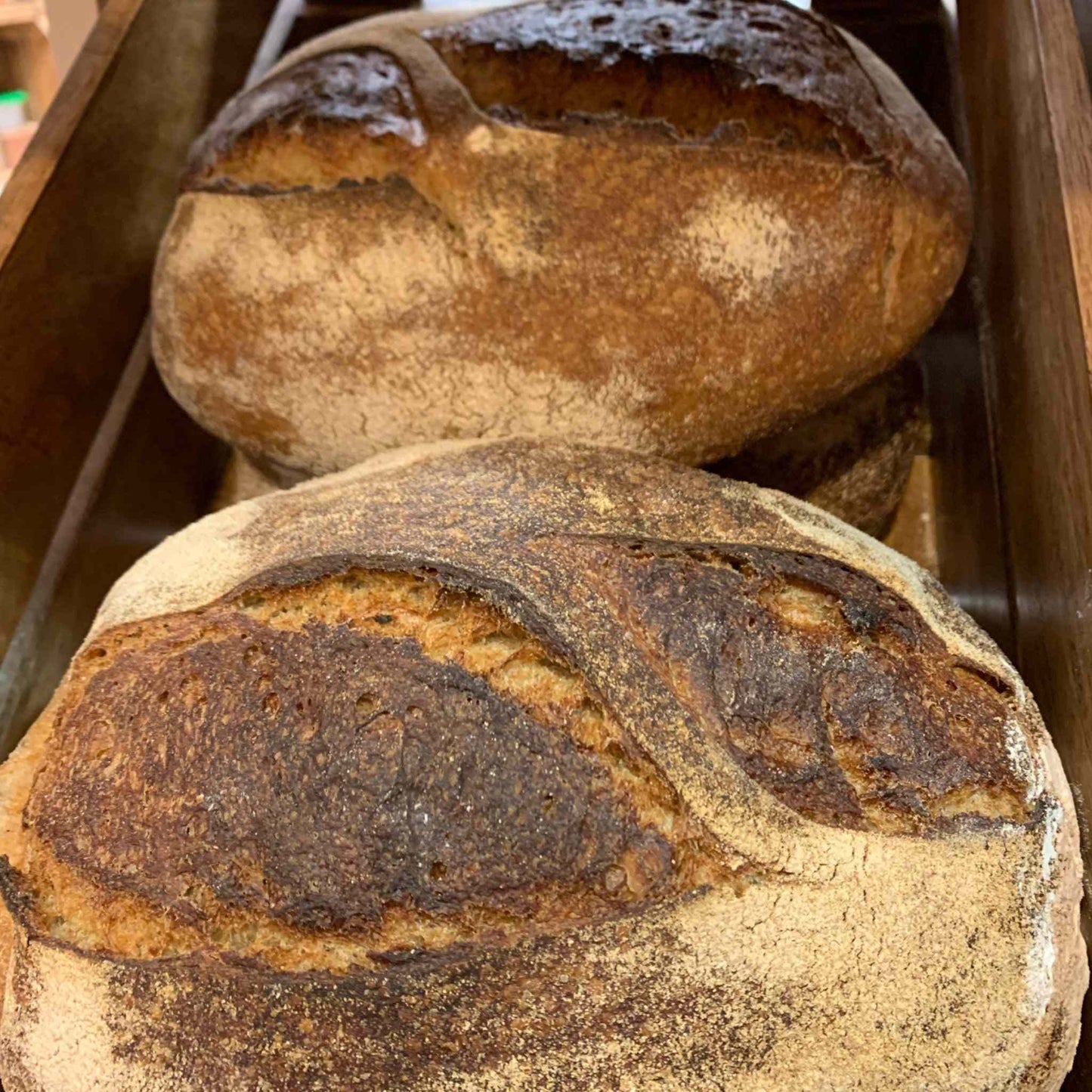 Artisanal sourdough bread with a crusty exterior and soft interior, crafted through a 24-hour fermentation process.