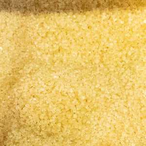 Close-up of golden Demerara sugar crystals, 100g.