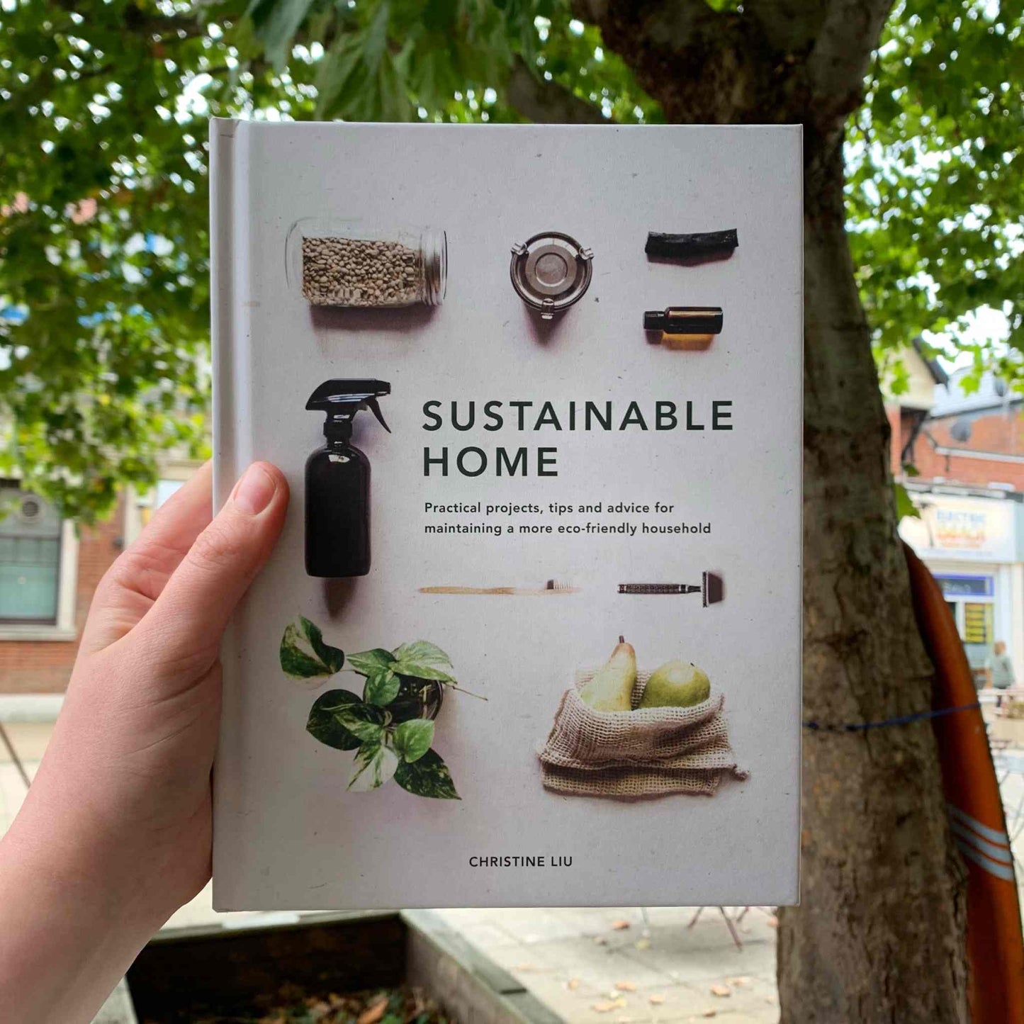'Sustainable Home' book by Christine Liu held outdoors.