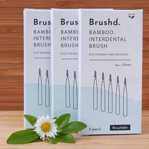 Bamboo Interdental Brush by Brushd, eco-friendly dental care, 0.6mm size, sustainable bamboo packaging.