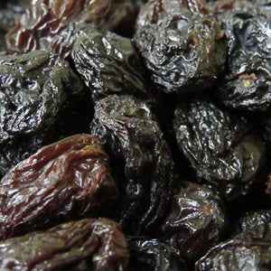Jumbo black raisins 100g, close-up showing plump, juicy texture.