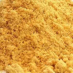 Mustard powder 25g close-up view, showcasing its fine texture and rich color.