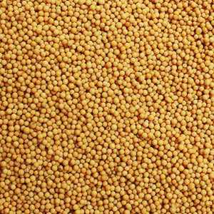 Yellow mustard seeds (25g) close-up view.