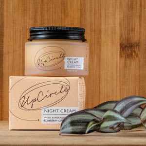 Night cream by UpCircle in a recyclable glass jar with packaging, eco-friendly skincare product.