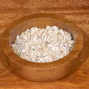 Oats porridge 100g in wooden bowl, healthy breakfast option.