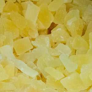 Diced dried pineapple chunks close-up, 100g pack.