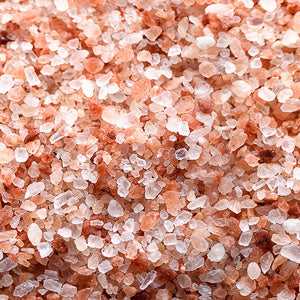 Pink Himalayan salt crystals in close-up view, highlighting its unique pink hue and crystalline texture.