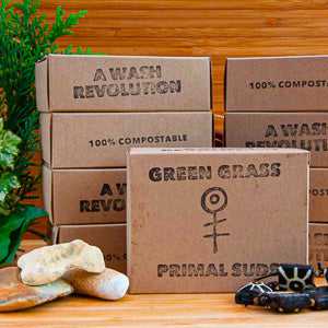 Eco-friendly soap bars by Primal Suds in compostable packaging.