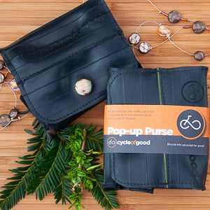 Eco-friendly Pop-up Purse by Cycle of Good made from upcycled materials with versatile design and handcrafted quality.