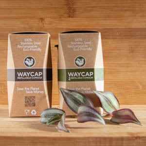 Eco-friendly Refillable Coffee Capsules Kit with Dispenser by Waycap on wooden surface.