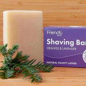 Orange and lavender shaving bar with zero-waste packaging by Friendly Soap.