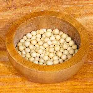 Organic soya beans in a wooden bowl, 100g package.