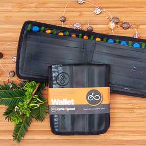 Eco-friendly inner tube wallet by Cycle of Good, crafted from upcycled bicycle tubes with unique and durable design.