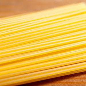 White spaghetti (100g) made from premium durum wheat, ideal for gourmet dishes.