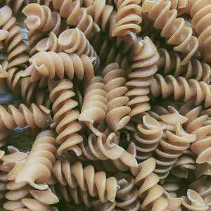 Organic wholewheat fusilli pasta, 100g, rich in fiber and nutrients.