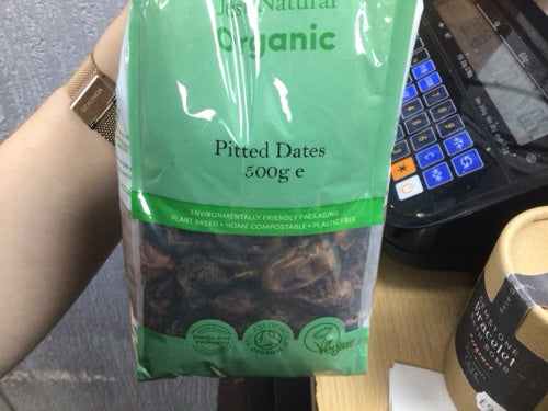 Organic pitted dates 500g package on display.