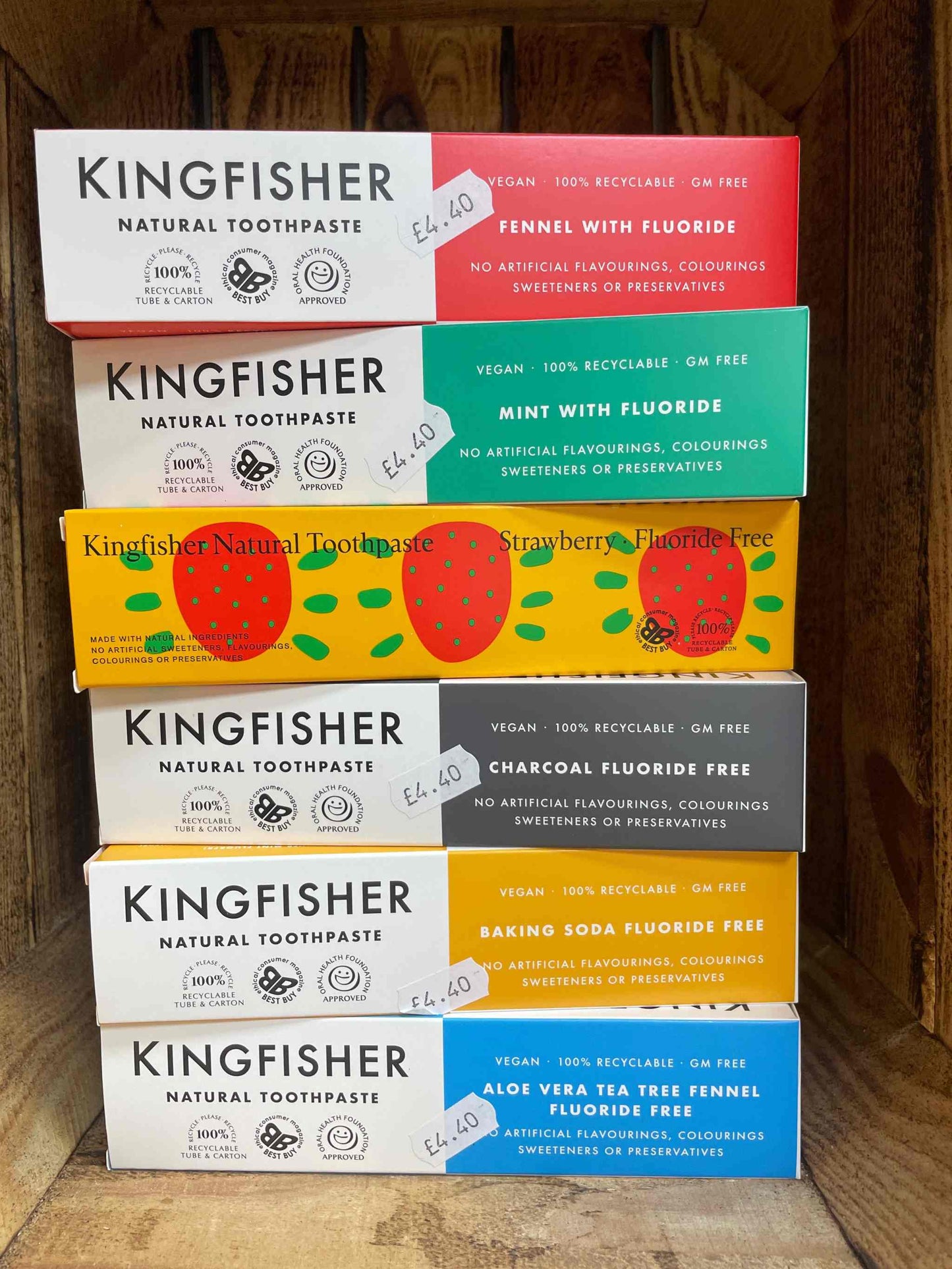 Kingfisher Natural Toothpaste display showcasing various flavors and eco-friendly packaging.