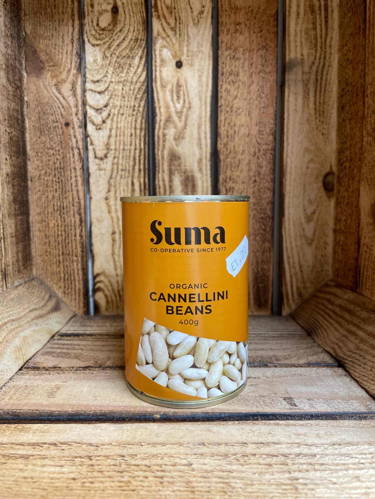 Organic Cannellini Beans in can, 400g, on wooden background.