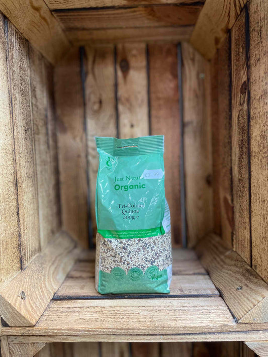 Organic Tri-Colour Quinoa in rustic wooden packaging.