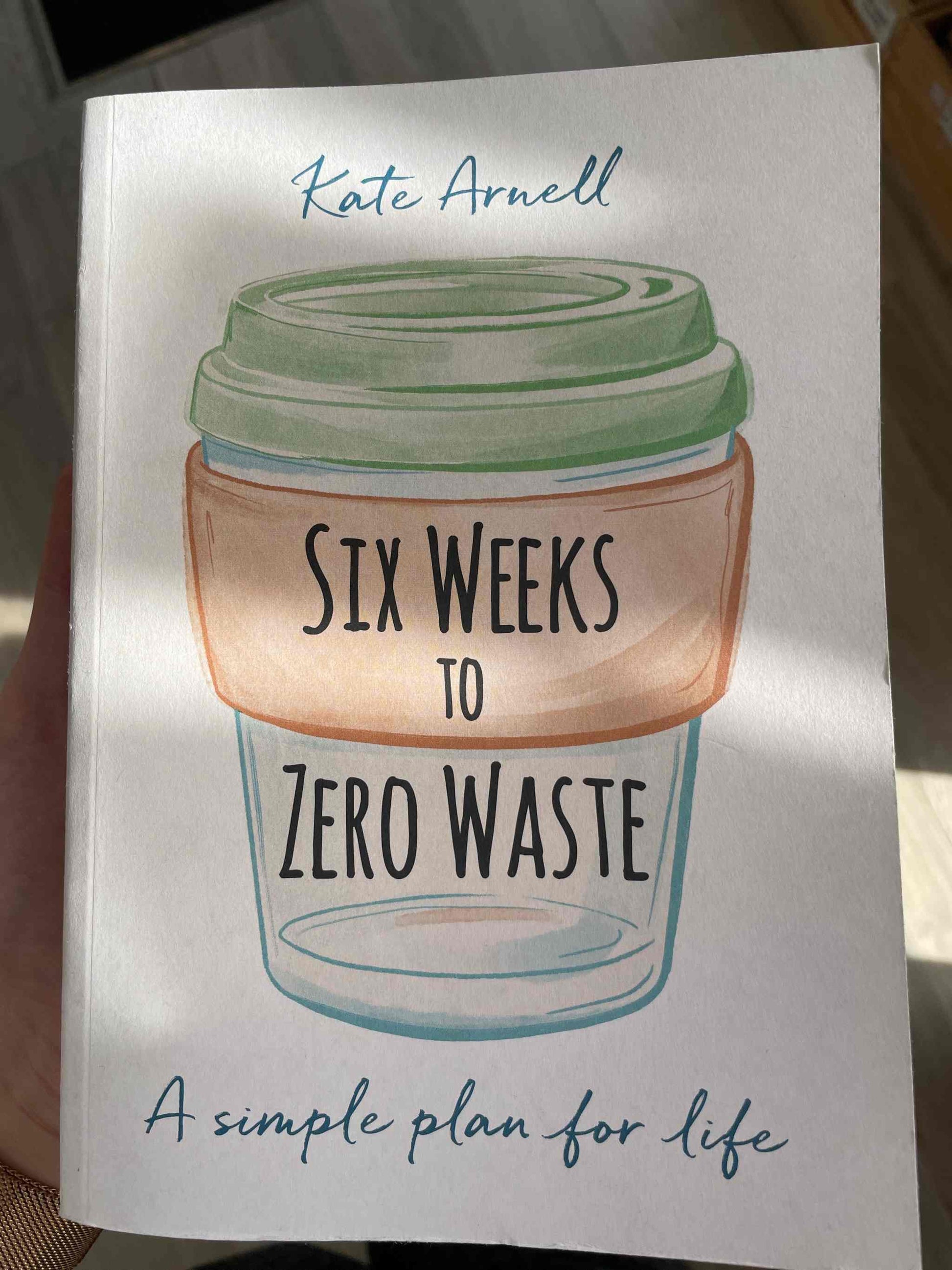 Book cover of "Six Weeks to Zero Waste" featuring a reusable cup illustration.