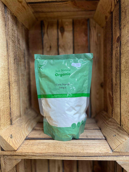 Organic corn starch 500g package in a wooden shelf, ideal for gluten-free cooking and baking.