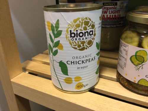 Biona Organic Chickpeas can in water, 400g, displayed on a wooden shelf.