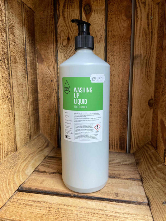 1L pre-filled washing up liquid with pump in wooden background.