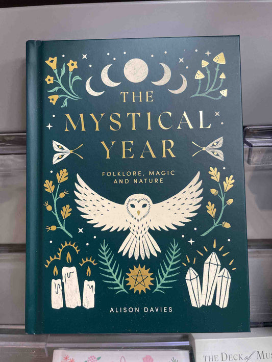 The Mystical Year book cover featuring an owl, candles, and nature motifs, by Alison Davies.
