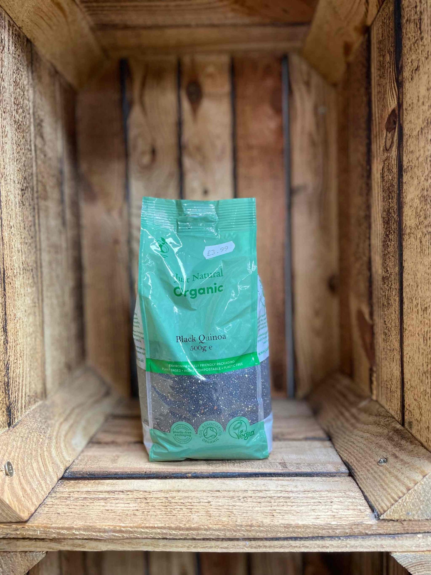 Organic Black Quinoa 500g package in wooden crate.