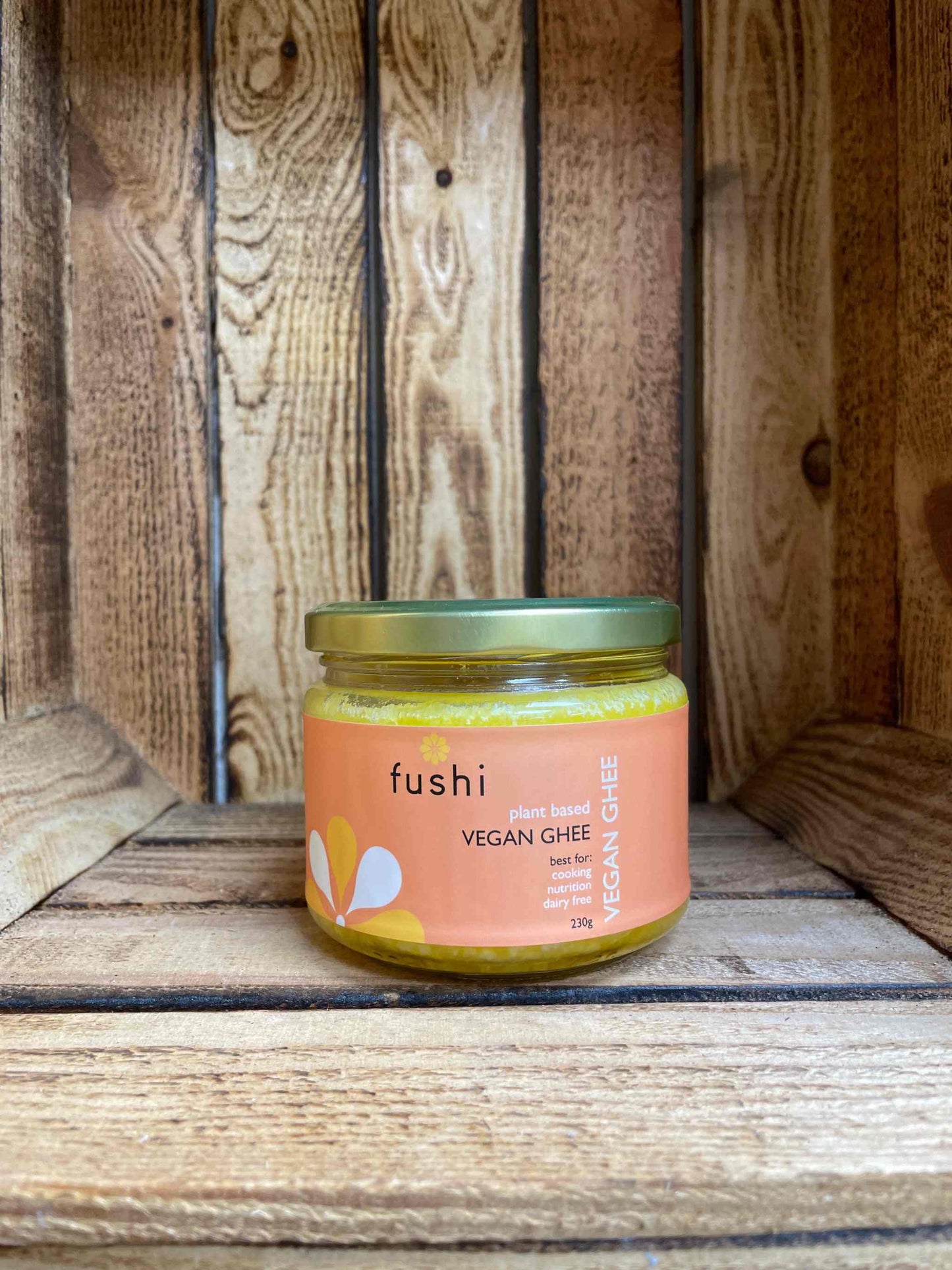 Fushi Vegan Ghee jar on wooden background, plant-based and organic.